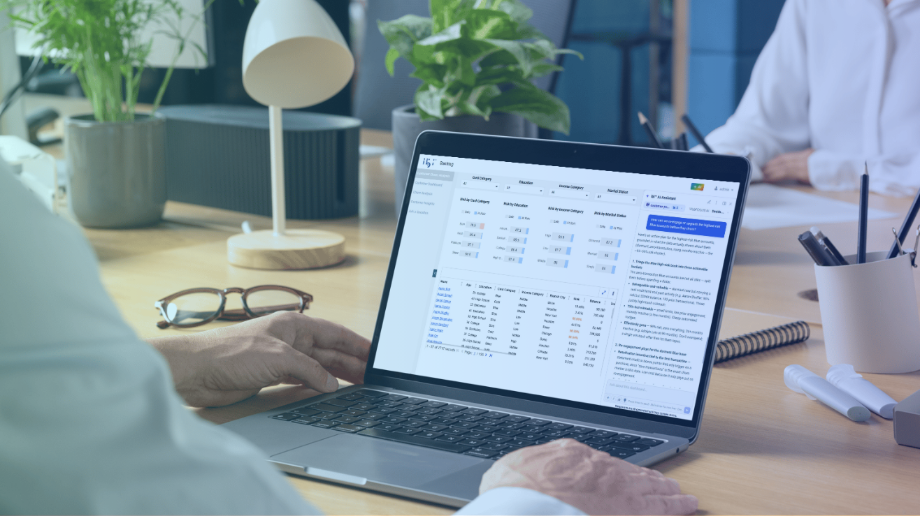 a person working on a laptop displaying a financial or operational data spreadsheet with a chat or assistant sidebar on a wooden office desk.